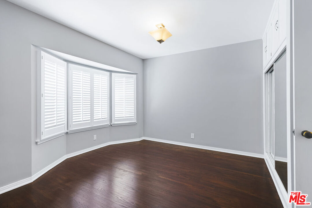 5343 Blanco Way Culver City, CA 90230 - Photo 20 of 30 an empty room with wooden floor and windows
