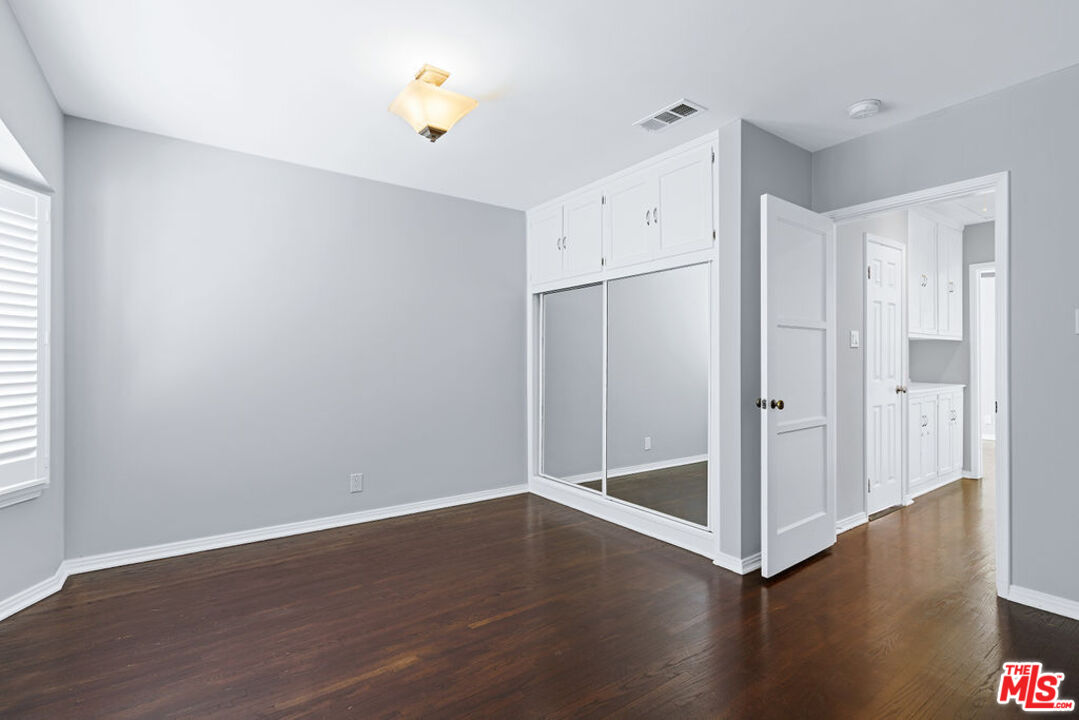 5343 Blanco Way Culver City, CA 90230 - Photo 21 of 30 an empty room with wooden floor and a window