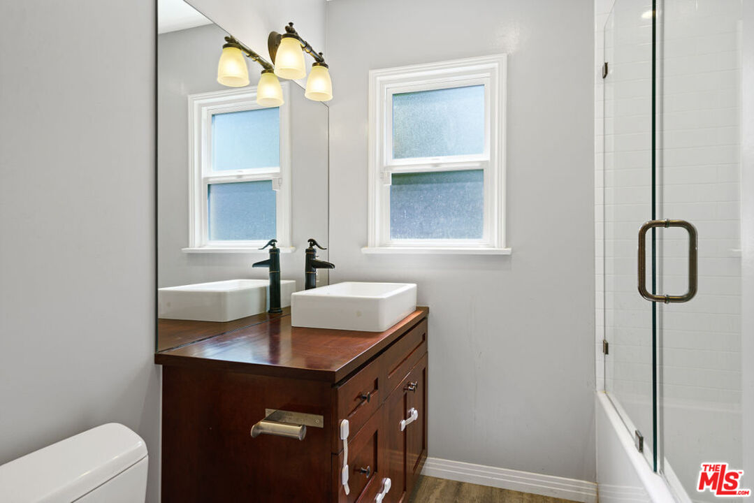5343 Blanco Way Culver City, CA 90230 - Photo 22 of 30 a bathroom with a sink vanity and toilet