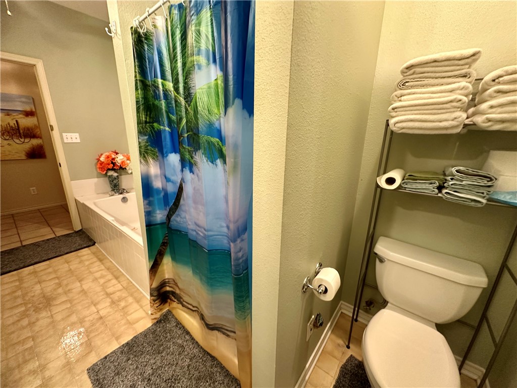 39 Front Street Rockport, TX 78382 - Photo 11 of 38 a bathroom with a toilet and a shower