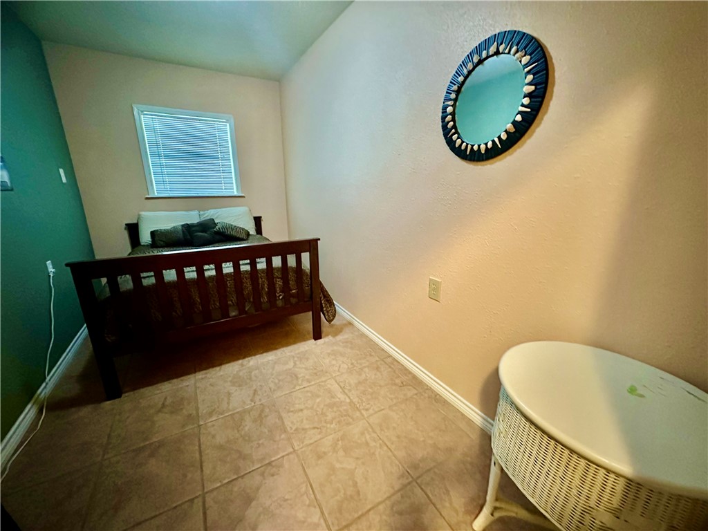 39 Front Street Rockport, TX 78382 - Photo 17 of 38 a view of a room with wooden floor and windows