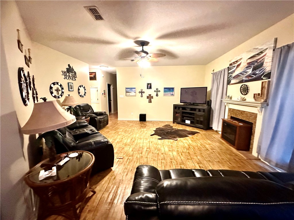 39 Front Street Rockport, TX 78382 - Photo 2 of 38 a living room with furniture and a flat screen tv