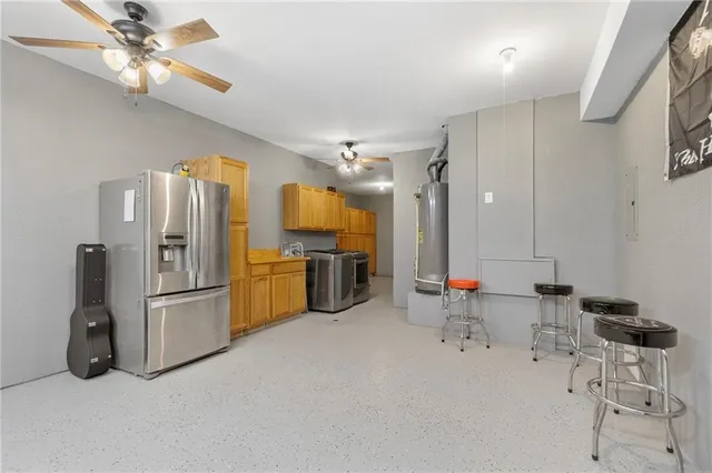 a living room with furniture and kitchen view
