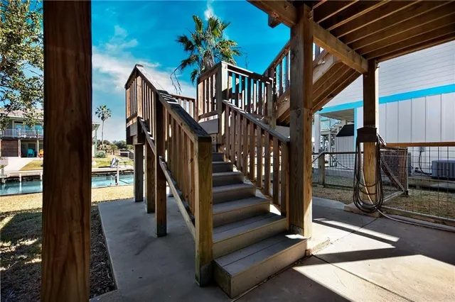 a view of staircase with wooden floor and a potted plant
