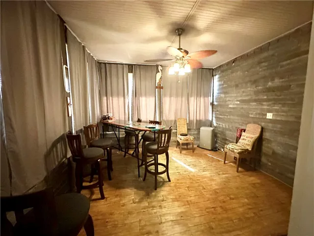 a view of a a dining room with furniture window and outside view