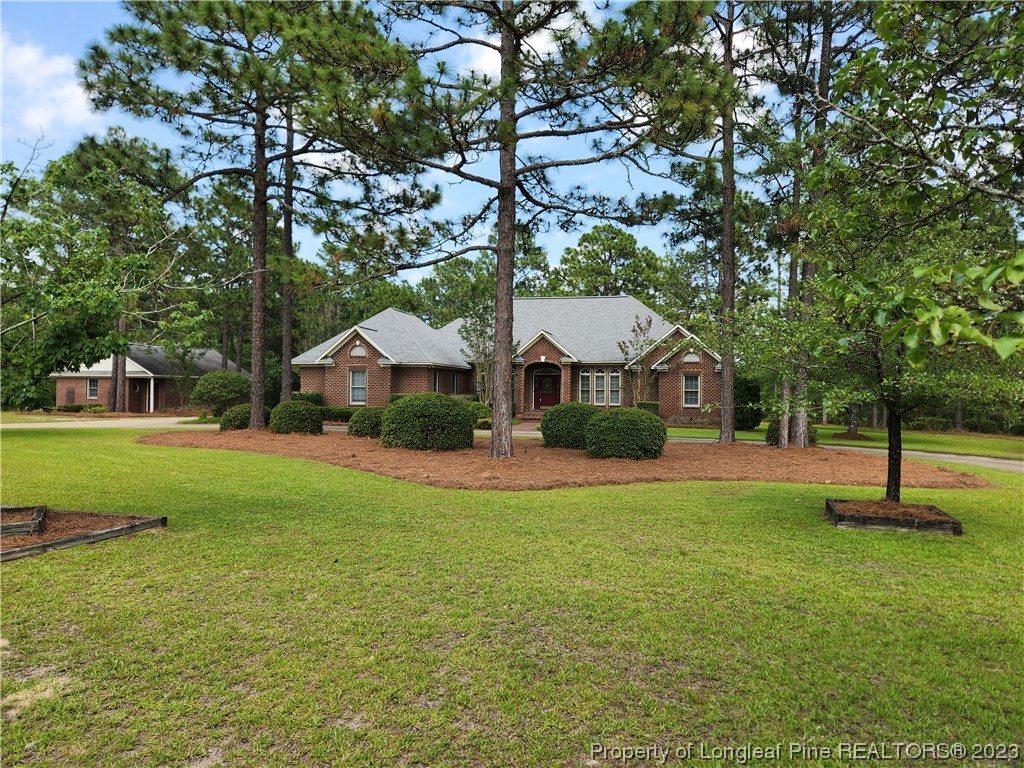 2730 Chimney Point Linden, NC 28356 - Photo 1 of 30 a front view of a house with a yard