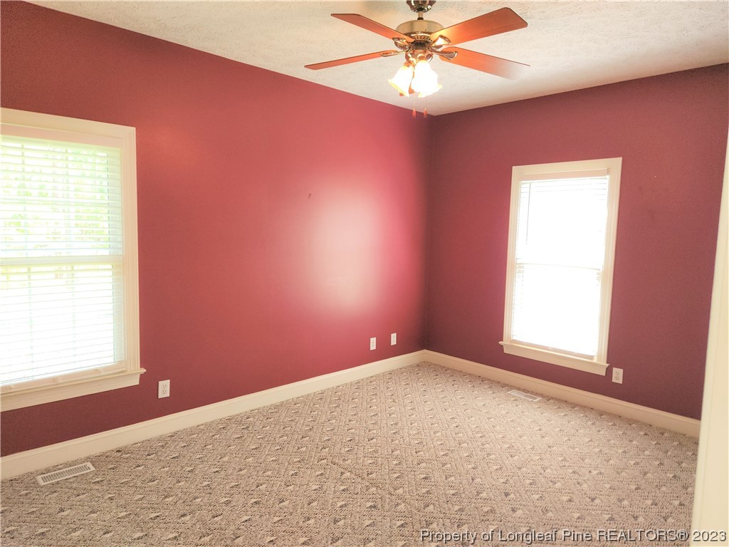 2730 Chimney Point Linden, NC 28356 - Photo 12 of 30 an empty room with a window and a fan