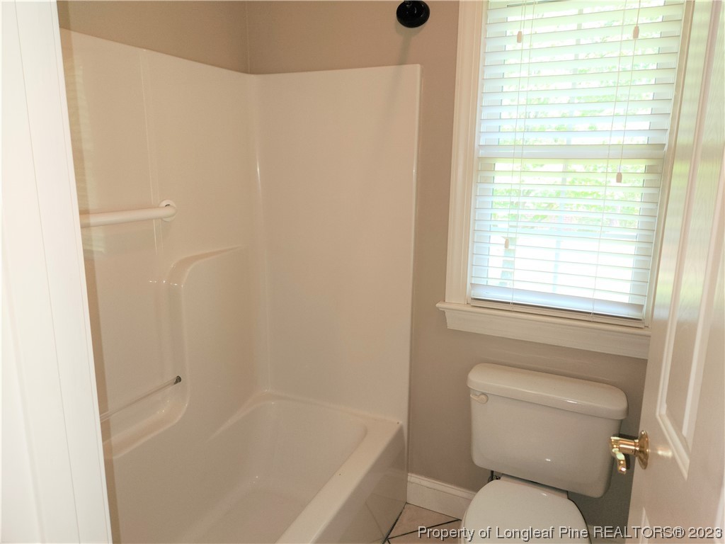 2730 Chimney Point Linden, NC 28356 - Photo 14 of 30 a bathroom with a toilet and a shower
