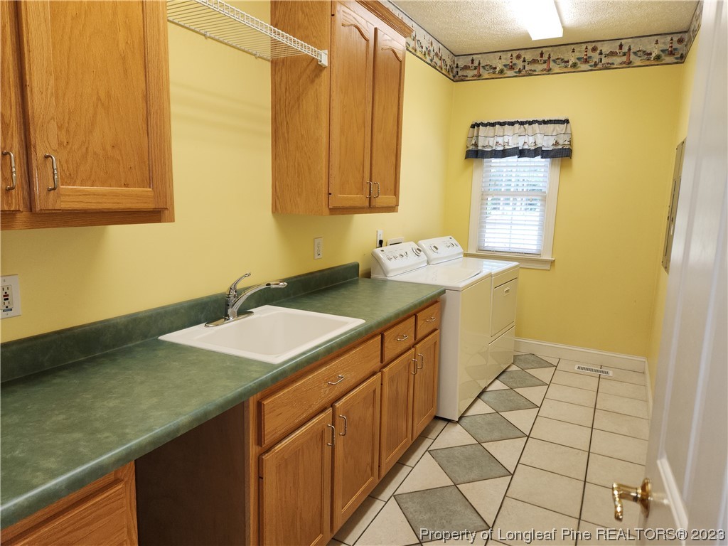 2730 Chimney Point Linden, NC 28356 - Photo 18 of 30 a bathroom with a sink and a mirror