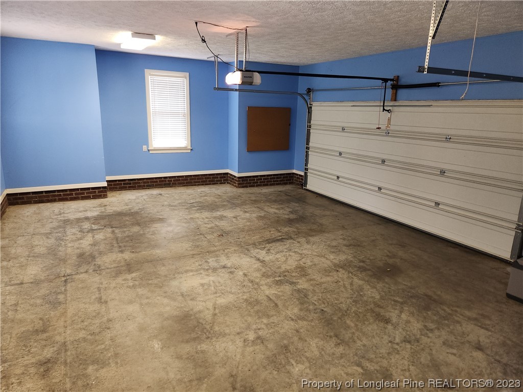 2730 Chimney Point Linden, NC 28356 - Photo 19 of 30 a view of an empty room with window and chandelier fan