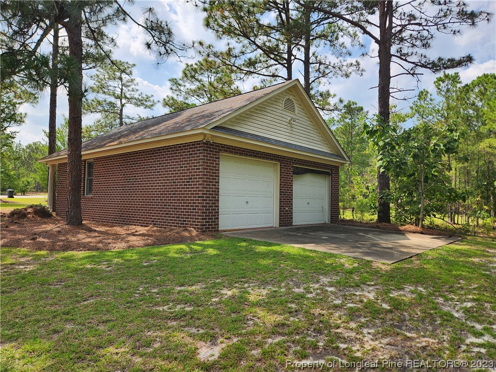 2730 Chimney Point Linden, NC 28356 - Photo 23 of 30 a backyard of a house with lots of green space