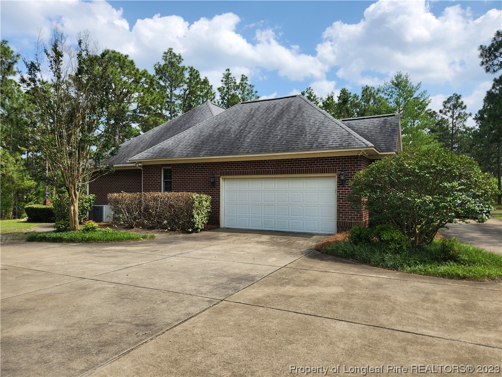 2730 Chimney Point Linden, NC 28356 - Photo 24 of 30 a front view of house with yard and trees