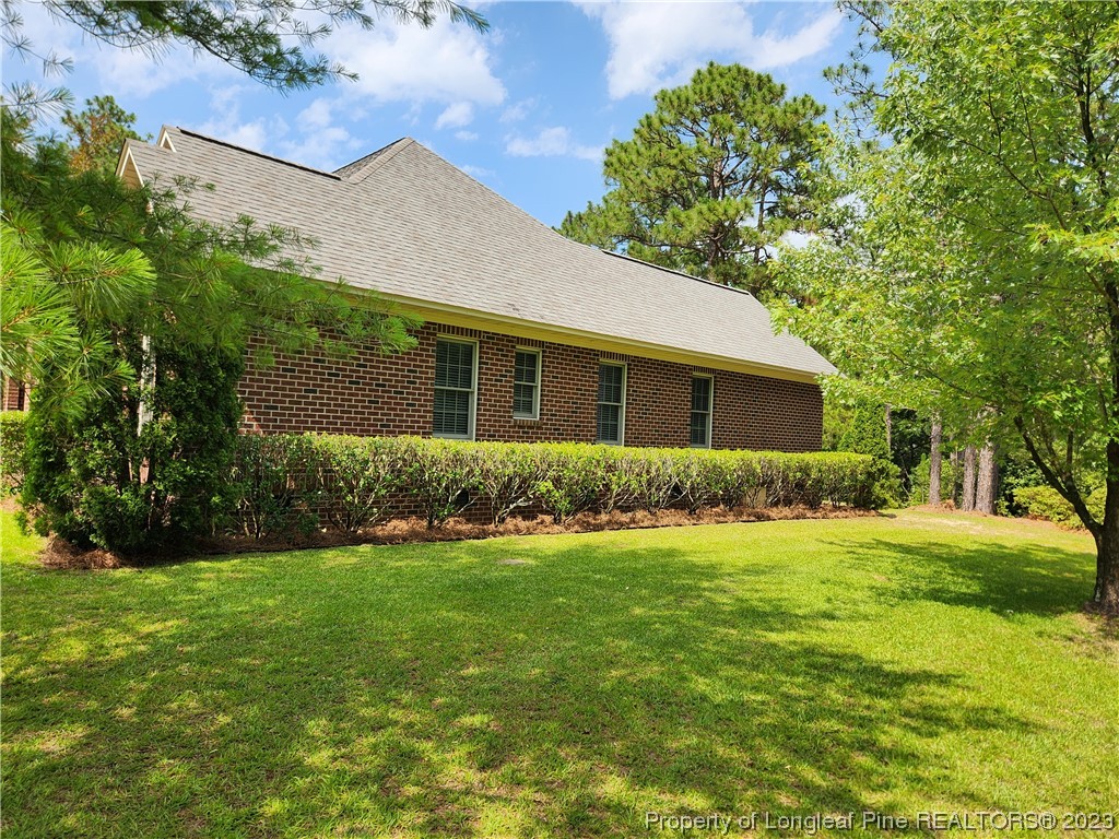 2730 Chimney Point Linden, NC 28356 - Photo 26 of 30 a front view of house with yard and green space