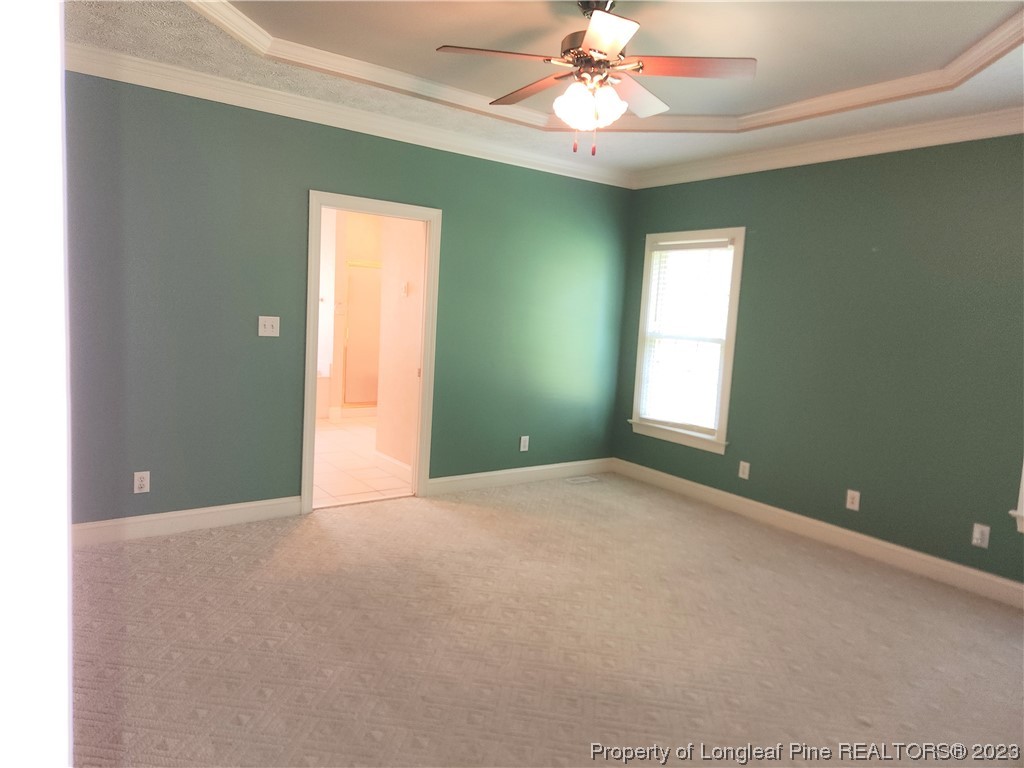 2730 Chimney Point Linden, NC 28356 - Photo 9 of 30 a view of an empty room with window and chandelier fan