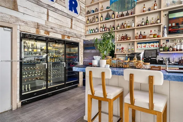 a view of a patio with a table and chairs under an umbrella