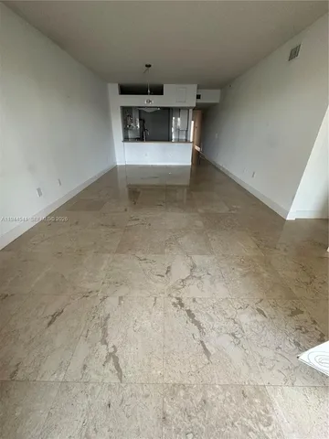 a kitchen that has a sink and a stove