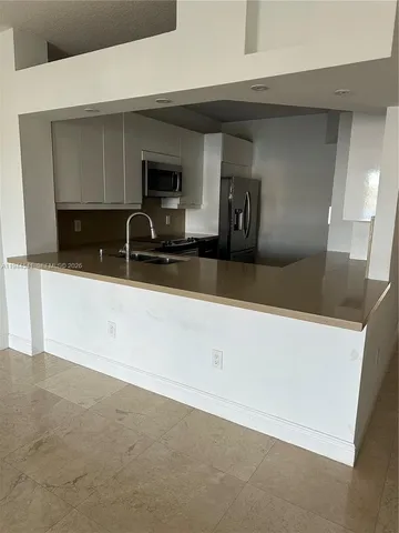 a view of empty room with windows