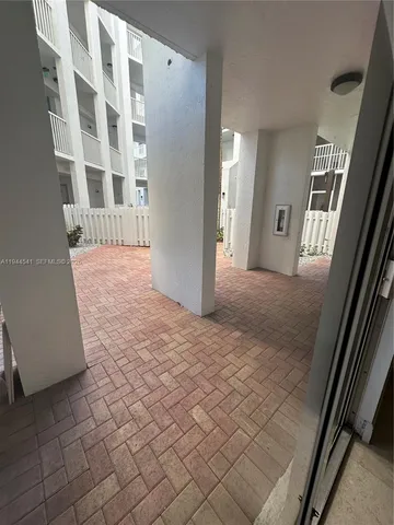 a bathroom with a granite countertop sink toilet a mirror and shower