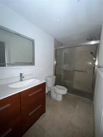 a kitchen with stainless steel appliances a refrigerator and a stove top oven