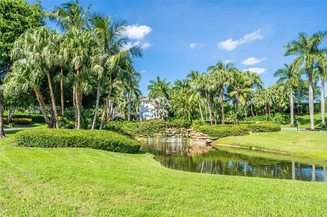 a view of a swimming pool with a garden