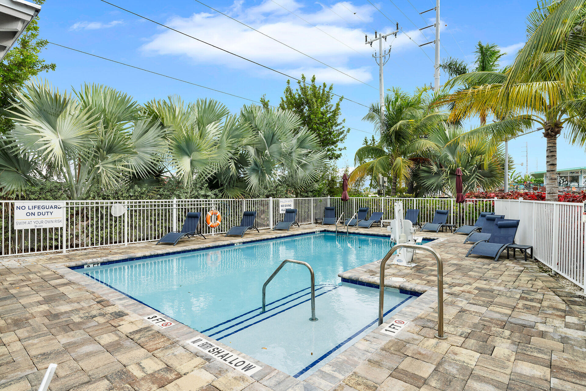 101 11th Street, Unit 19 Marathon, FL 33050 - Photo 19 of 27 a view of a chairs and table in the patio