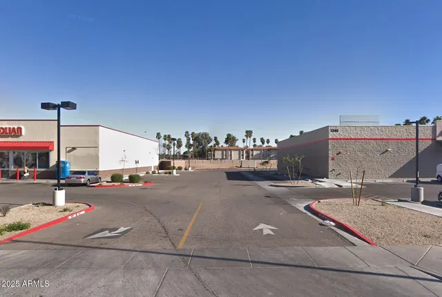 a view of a chairs and table on the balcony