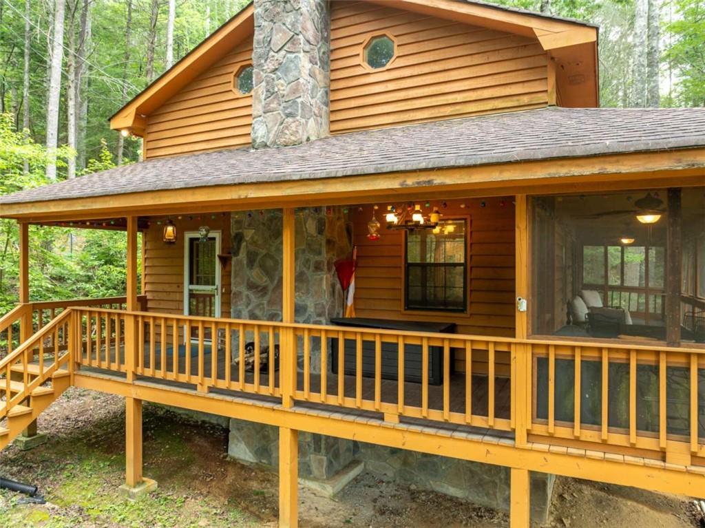 71 Cohutta Forest Road Chatsworth, GA 30705 - Photo 1 of 1 a view of a house with porch and wooden floor