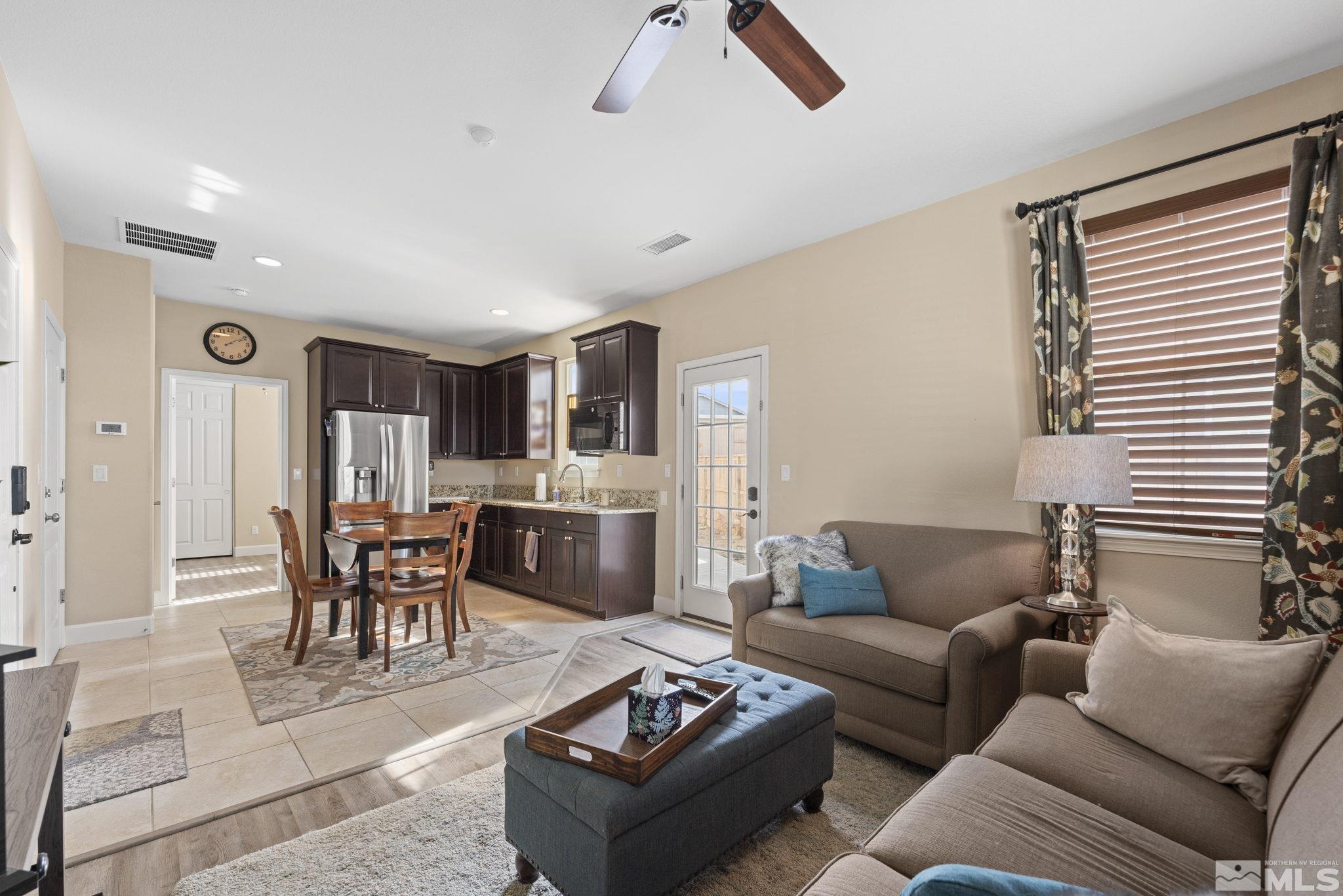 10674 Washington Reno, NV 89521 - Photo 25 of 40 a living room with furniture kitchen view and a window