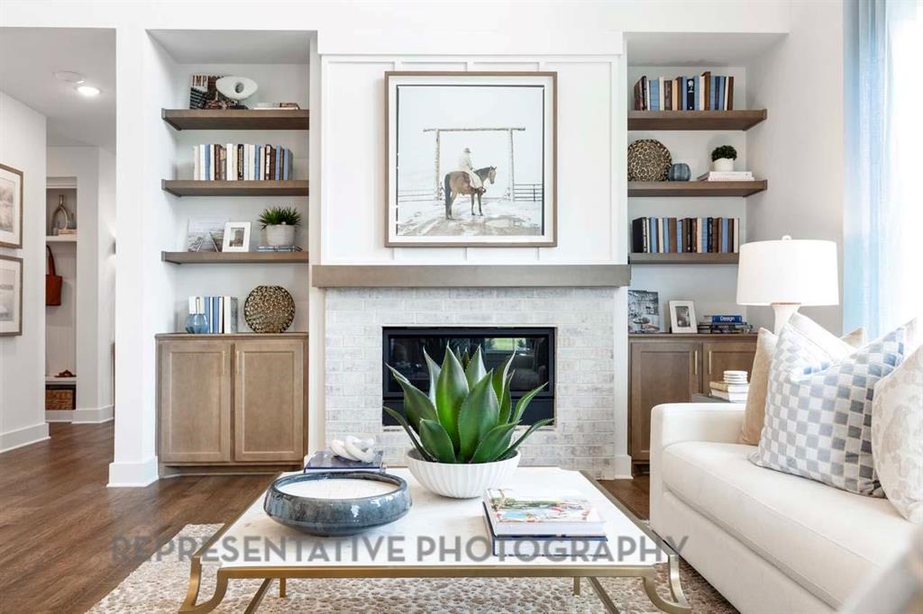 2140 Nerello Way Rockwall, TX 75032 - Photo 12 of 36 a living room with furniture and a fireplace