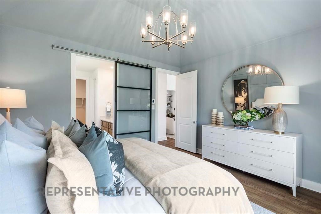 2140 Nerello Way Rockwall, TX 75032 - Photo 14 of 36 a living room with furniture and a chandelier