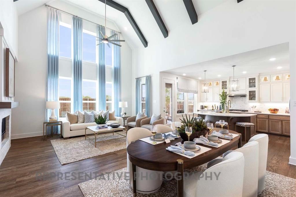 2140 Nerello Way Rockwall, TX 75032 - Photo 27 of 36 a dining room with furniture large window and wooden floor