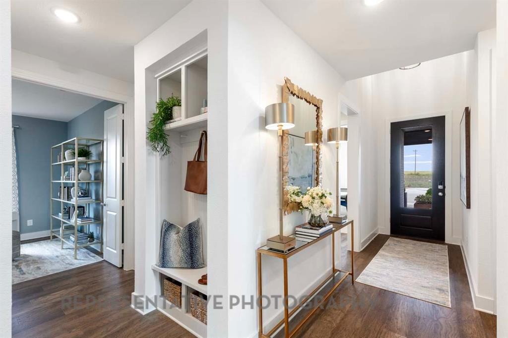 2140 Nerello Way Rockwall, TX 75032 - Photo 28 of 36 a room with cabinets and wooden floor