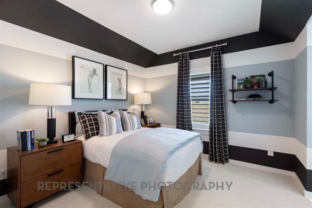 2140 Nerello Way Rockwall, TX 75032 - Photo 32 of 36 a bedroom with a bed lamps and kitchen view