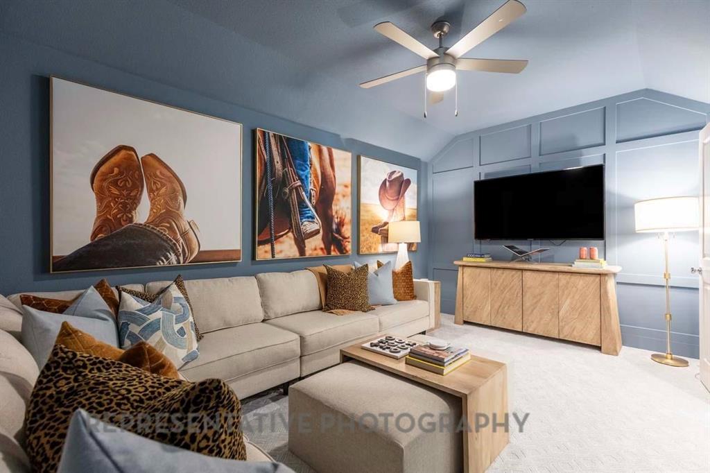 2140 Nerello Way Rockwall, TX 75032 - Photo 36 of 36 a living room with furniture and a flat screen tv