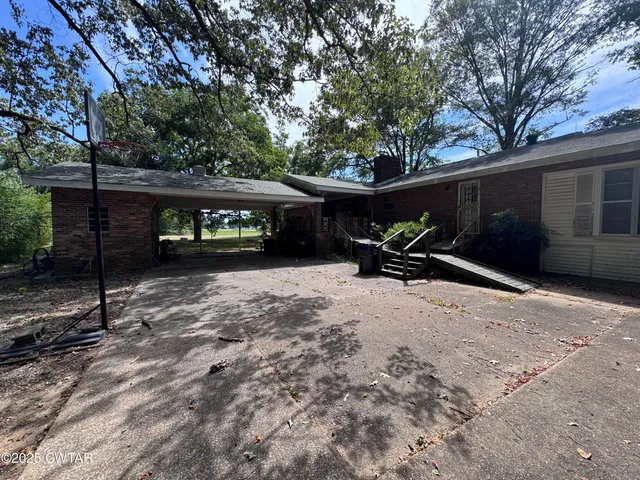 a view of a bench in front of house