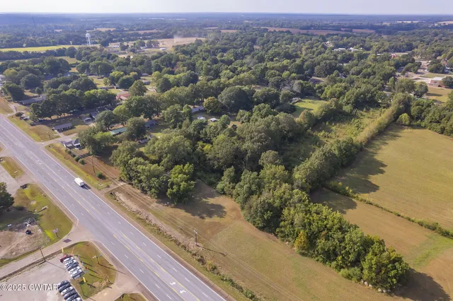 an aerial view of a city with mountains