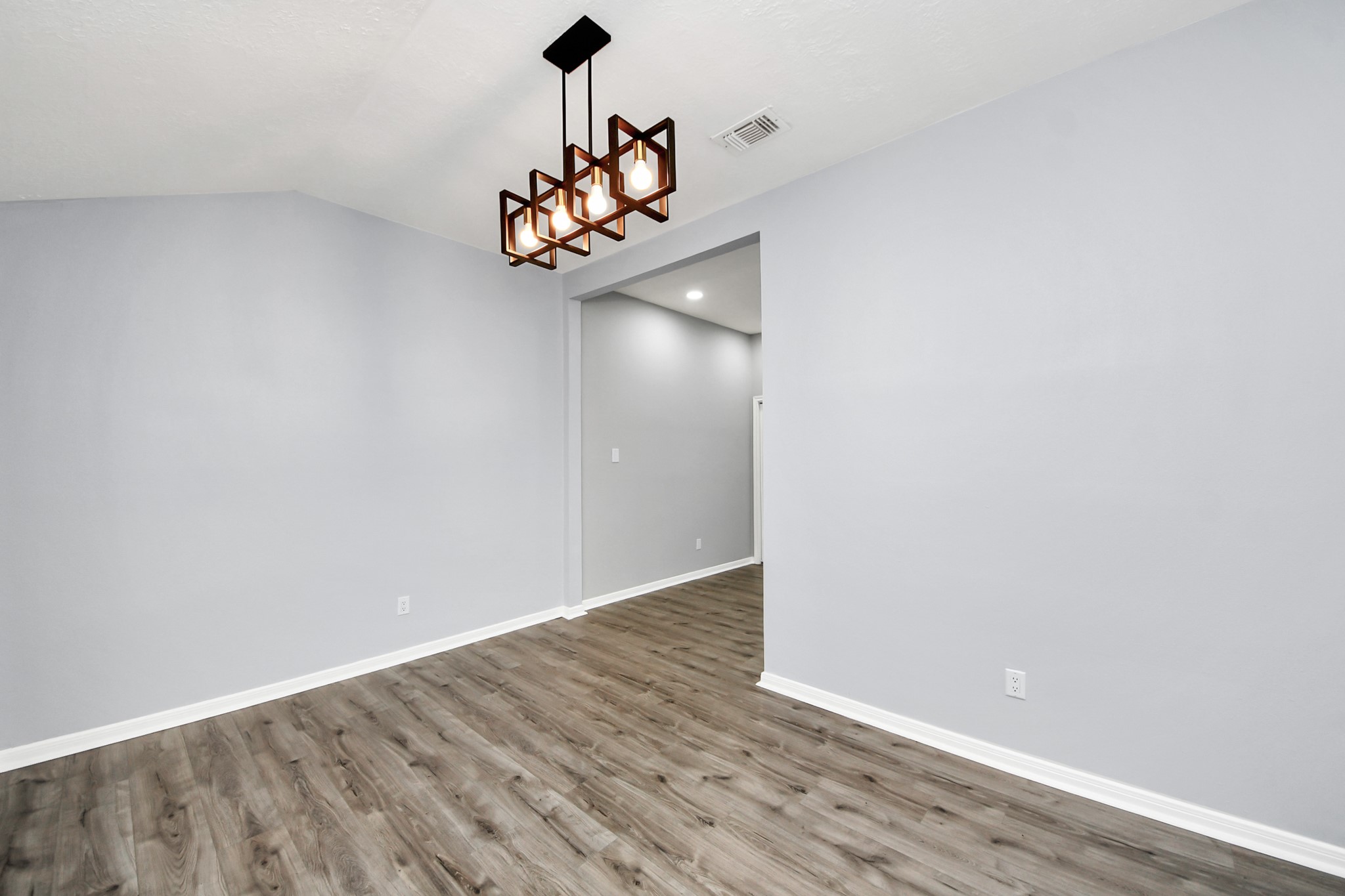11830 Plumpoint Drive Houston, TX 77099 - Photo 13 of 40 a view of a room with wooden floor and ceiling fan