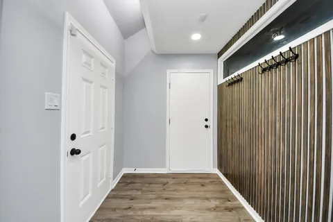 a view of a garage with rack and bicycle