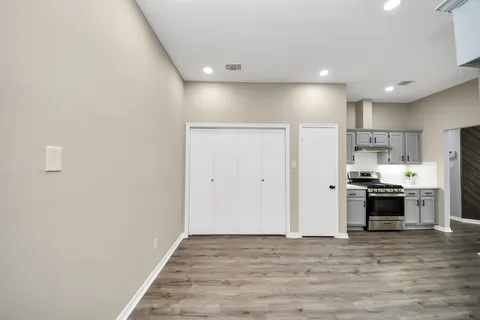 a view of a kitchen with a sink and a stove top oven