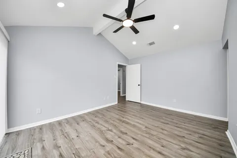 a view of livingroom with hardwood floor and a ceiling fan