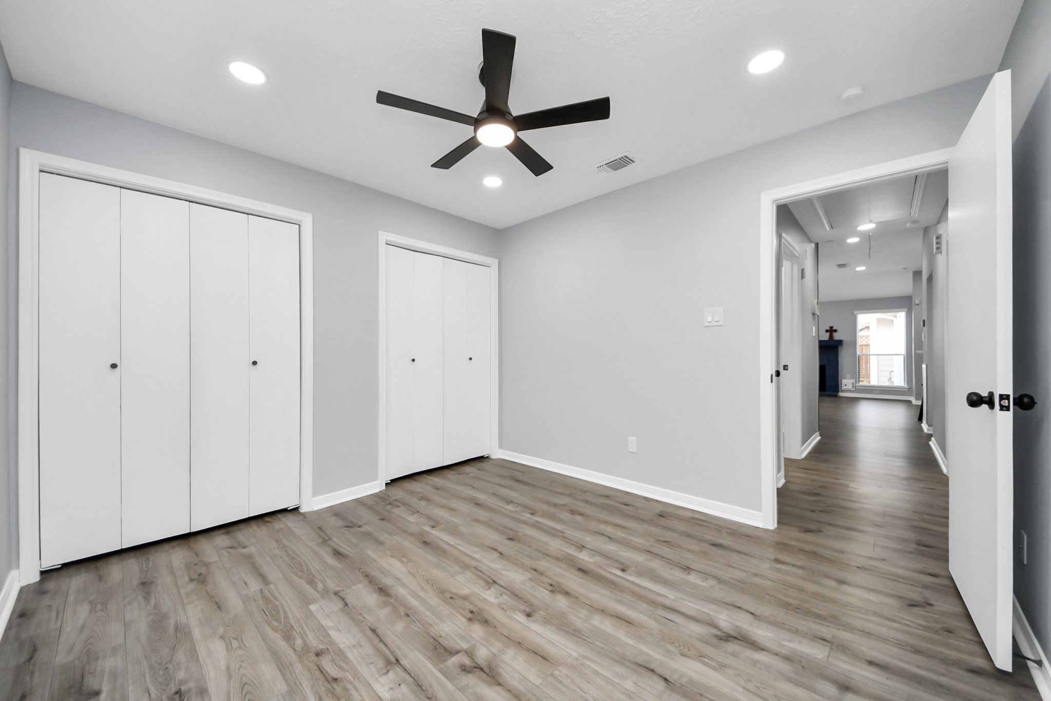 11830 Plumpoint Drive Houston, TX 77099 - Photo 36 of 40 wooden floor in an empty room with a window