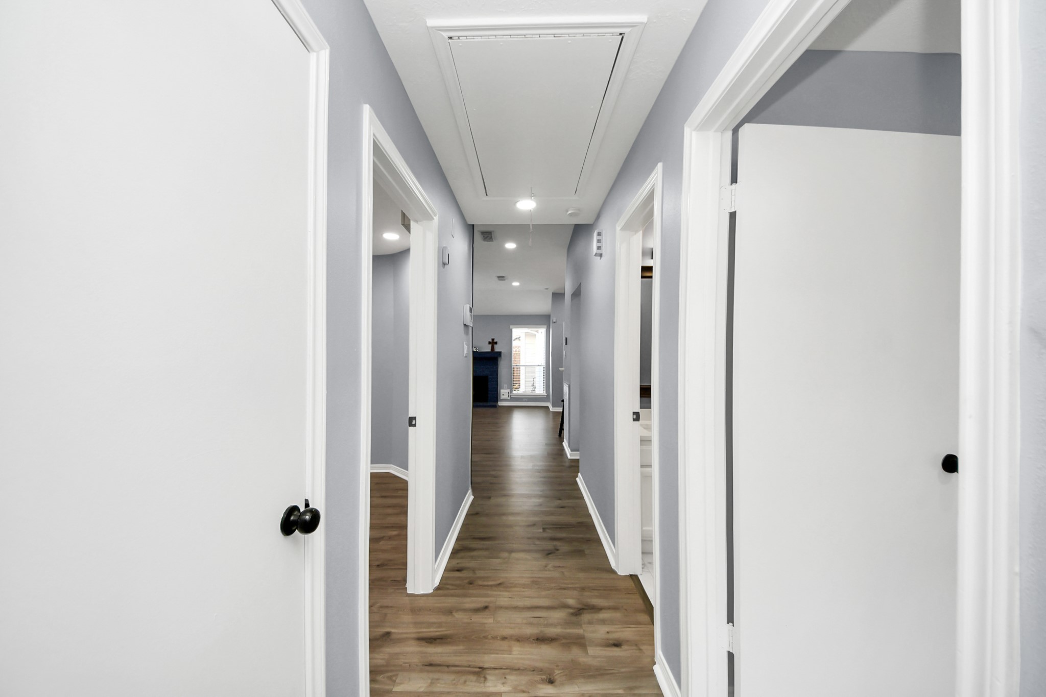 11830 Plumpoint Drive Houston, TX 77099 - Photo 39 of 40 a view of a hallway with wooden floor and staircase