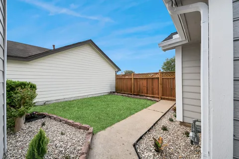 a backyard of a house with lots of green space