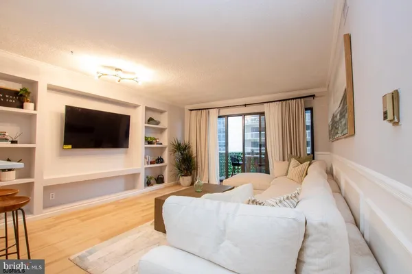 a large bedroom with a large bed and a flat screen tv