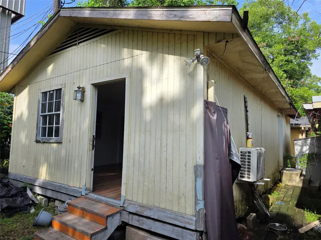 a kitchen with stainless steel appliances granite countertop a refrigerator a sink dishwasher a stove with wooden cabinets and floor