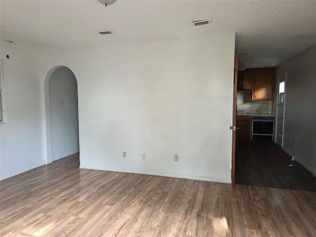 a view of hallway with wooden floor