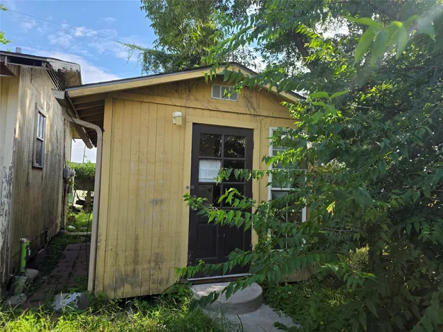 a backyard of a house with lots of green space