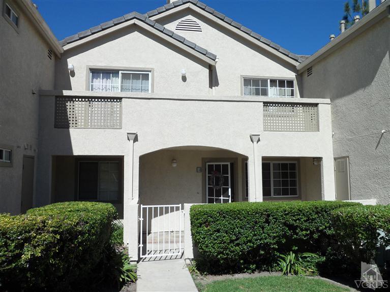 1031 Waltham Road, Unit E Simi Valley, CA 93065 - Photo 1 of 10 a front view of a house with a yard