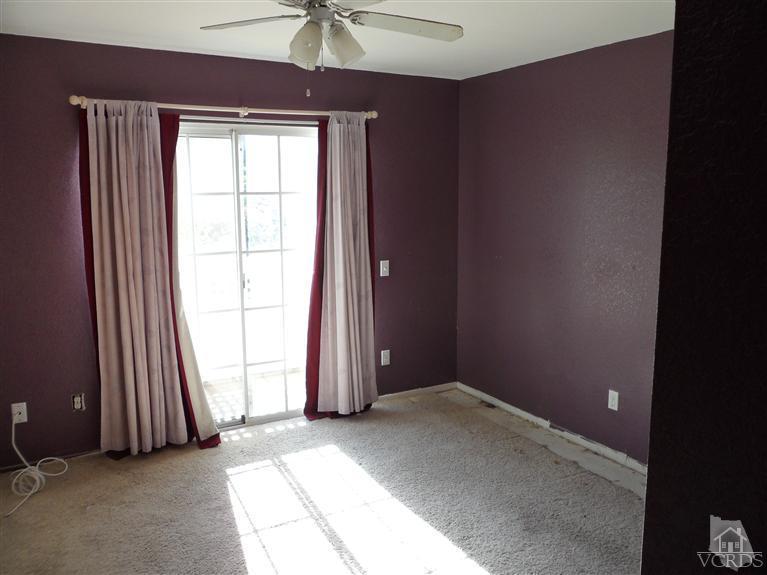 1031 Waltham Road, Unit E Simi Valley, CA 93065 - Photo 7 of 10 an empty room with windows