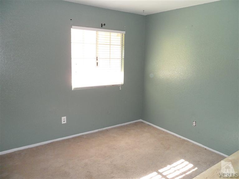 1031 Waltham Road, Unit E Simi Valley, CA 93065 - Photo 9 of 10 an empty room with a window
